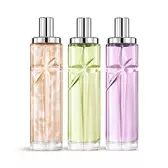 Starlicious the yummy swirl-laagjesbundel-packshot met Pineapple Musk, Pistachio Praline en Berry Licorice, glazen flacons met een kunstig gevormde vallende ster, waarvan de facetten helder stralen onder een strakke zilveren dop.